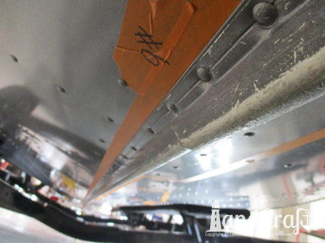 Picture of aluminum damage on bottom of a Lund boat