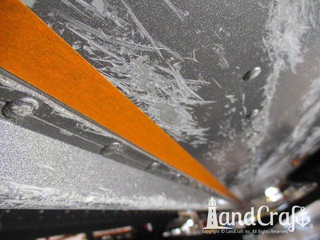 Picture of aluminum damage on bottom of a Lund boat