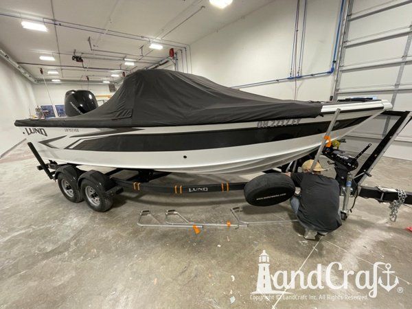 Aluminum Lund boat that has had dent and damage repaired and refinished