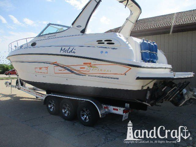 Dock rash damage through gelcoat and decals on Chaparral fiberglass boat