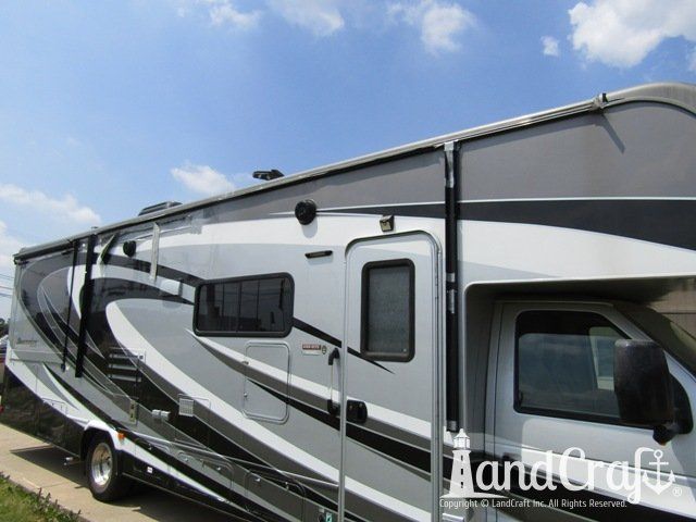 Forest River RV with side damage and tear punctured through due to an accident