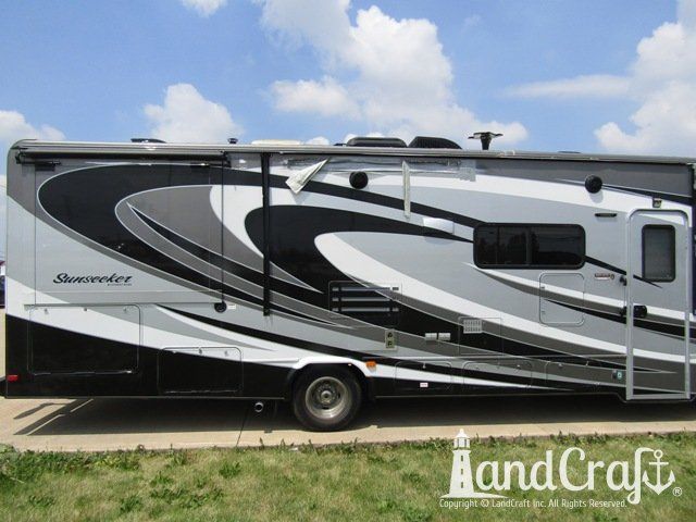 Forest River RV with side damage and tear punctured through due to an accident