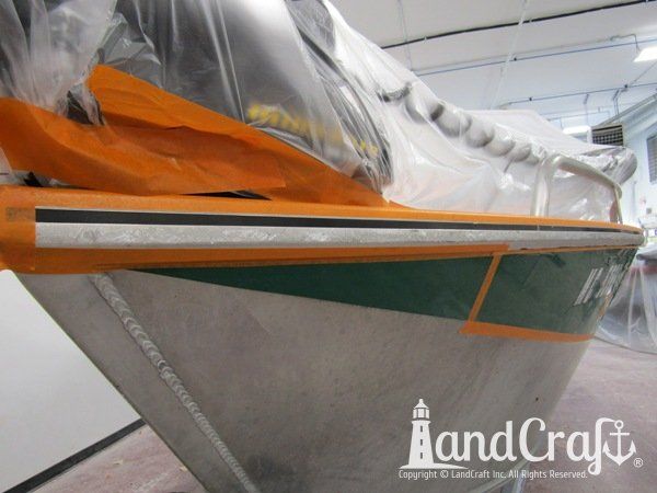 Picture of scratches along entire side of an aluminum Hewescraft boat