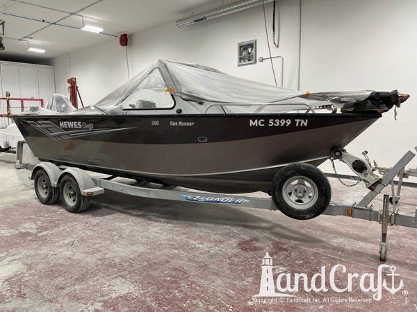 Picture of the repaired and refinished aluminum Hewescraft boat