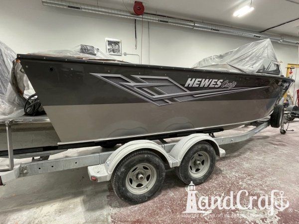 Picture of the aluminum Hewescraft boat with new decals applied