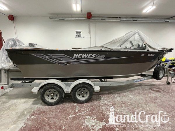 Picture of the aluminum Hewescraft boat with new decals applied