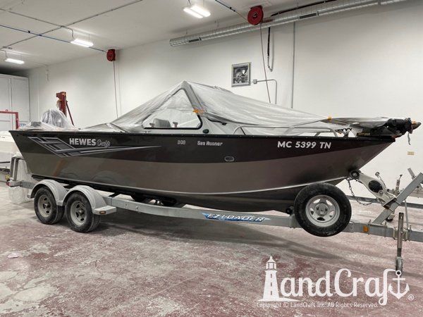 Picture of the aluminum Hewescraft boat with new decals applied