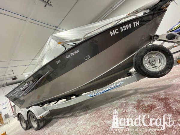 Picture of the repaired and refinished aluminum Hewescraft boat