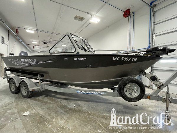 Picture of the repaired and refinished aluminum Hewescraft boat