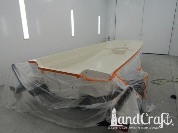 Boston Whaler in the LandCraft paint booth for gelcoat work on the upper decking