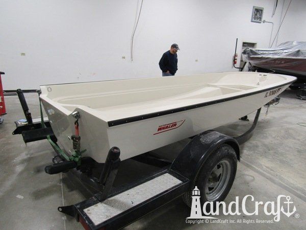 Boston Whaler with repairs completed on the bottom hull and top deck