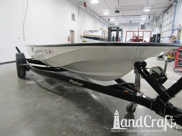 Boston Whaler with repairs completed on the bottom hull and top deck