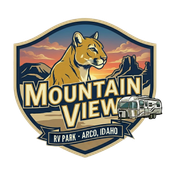 Mountain View RV Park and Restaurant logo featuring a cougar, mountains, RV, and sunset in Arco, Idaho.