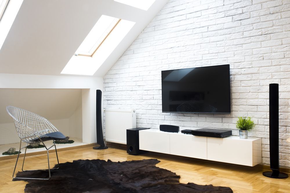 A Living Room With a Flat Screen Tv Mounted on the Wall — Garrow's TV & Antenna Services in Caloundra West, QLD