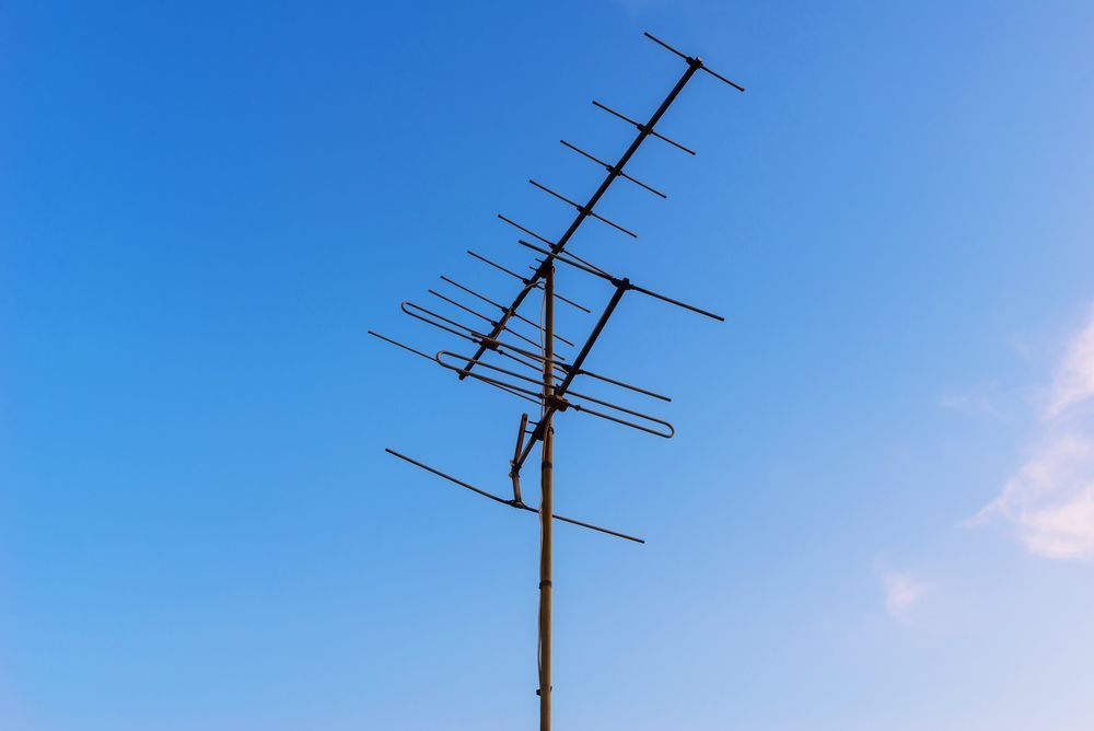 A Large Antenna Against a Blue Sky With Clouds — Garrow's TV & Antenna Services in Buderim, QLD