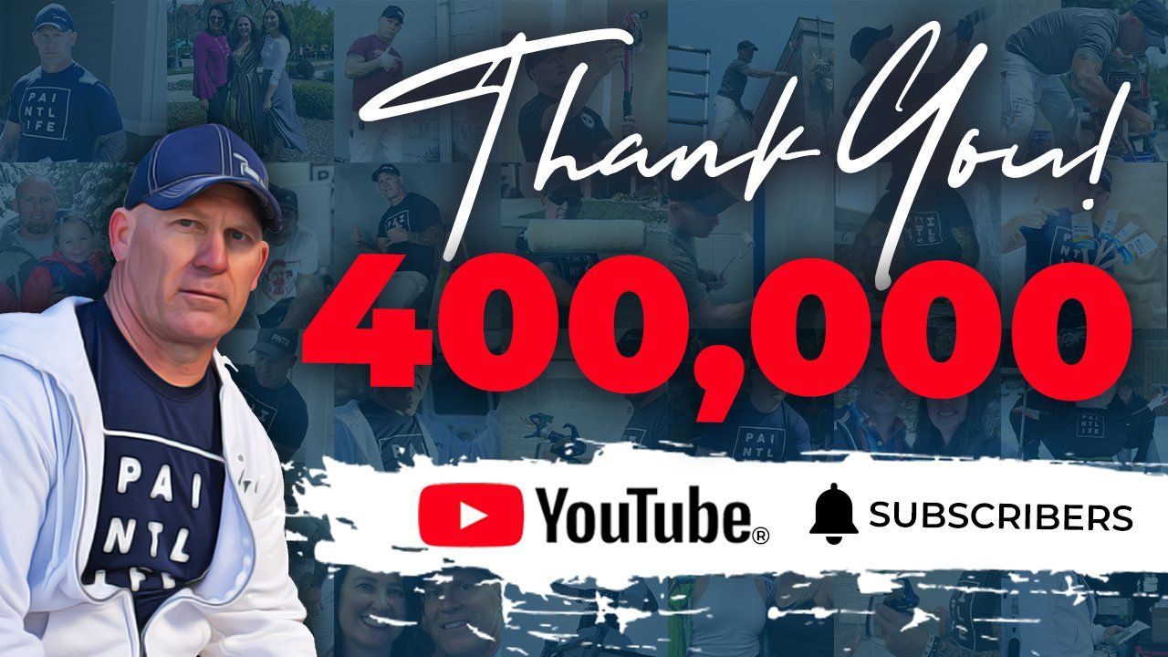 The Idaho Painter is sitting in front of a sign that says thank you 400,000 youtube subscribers