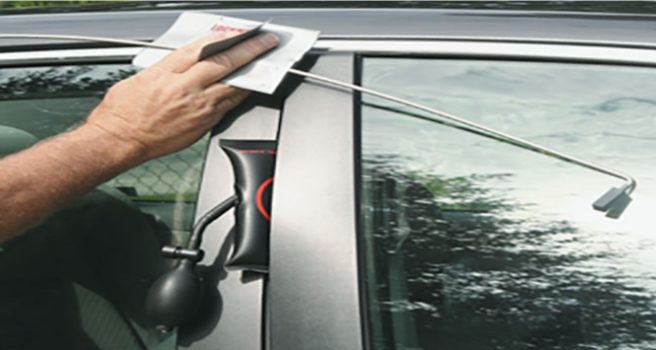 locked car being unlocked using a unlocking kit to recover keys