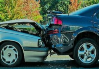 Picture of older blue car smashed into newer black car