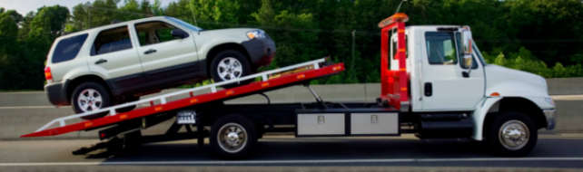Picture of SUV being towed down the freeway