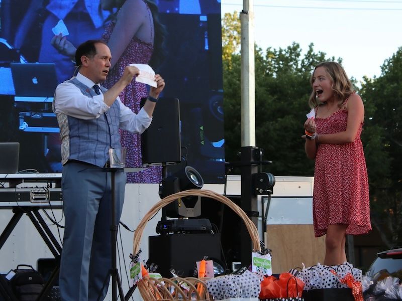 Stage magician David Martinez gets a jaw-dropping reaction from an audience helper.