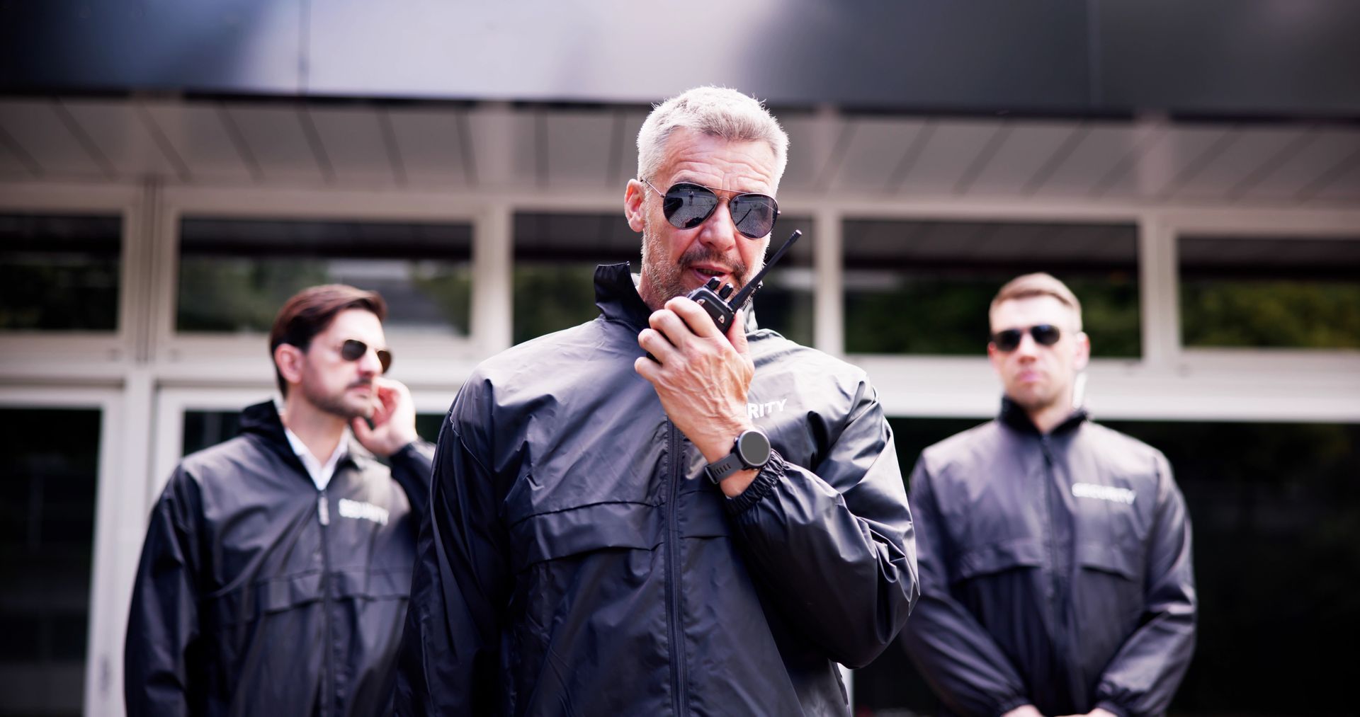 Experienced security guard with a team of bodyguards keeping a close watch. Experienced security guard with a team of bodyguards keeping a close watch.