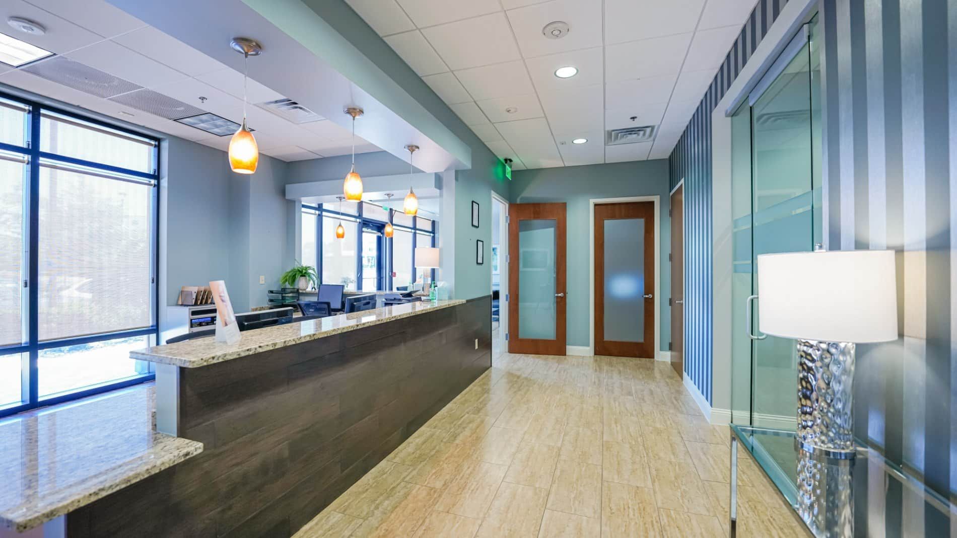 A long hallway with a counter in the middle of it