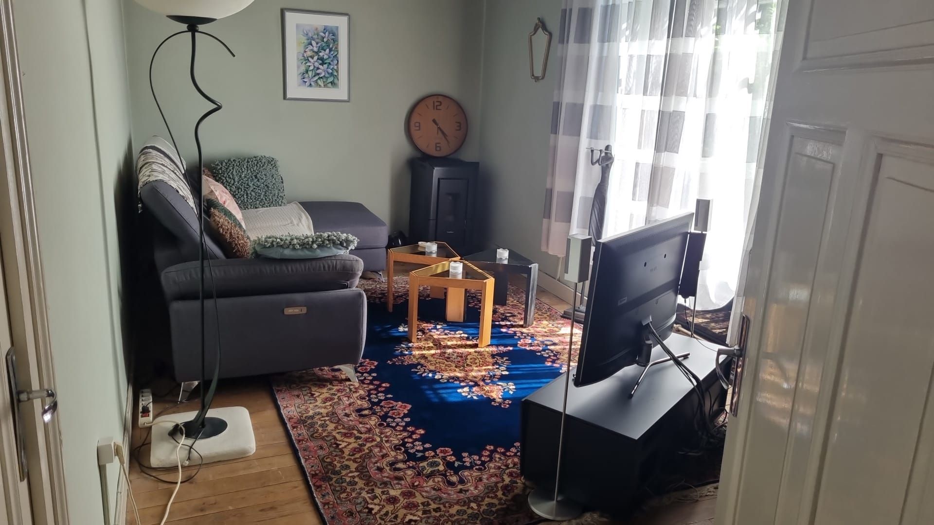 A living room with a couch a table and a fireplace