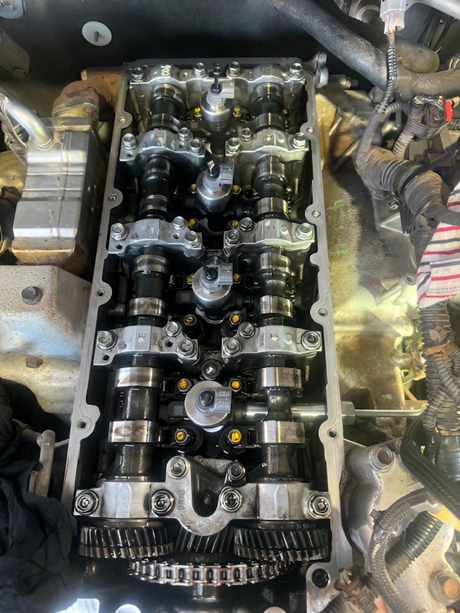 Diesel engine cylinder head with valvetrain components — specialist diesel mechanic servicing in Nowra