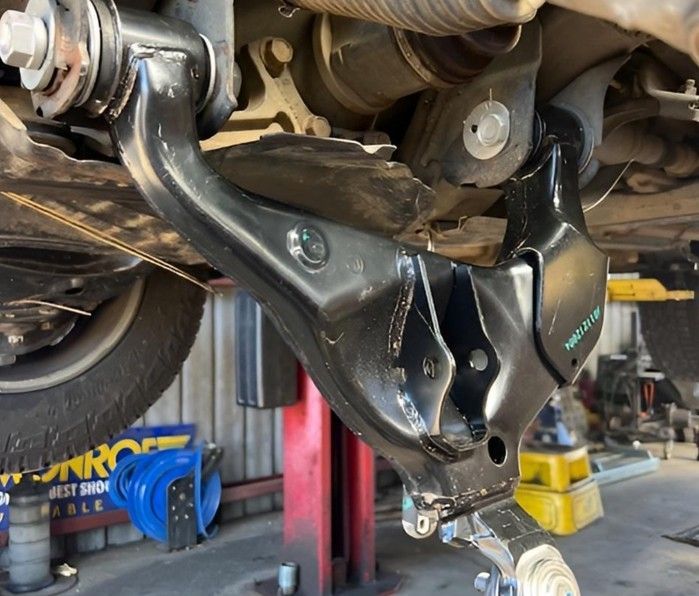 Mechanic Nowra Replacing Suspension Control Arm Under Vehicle