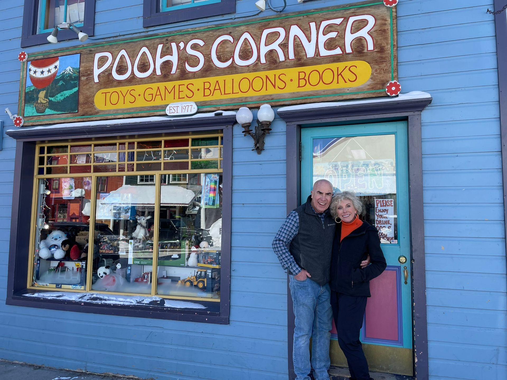 poohs corner owners standing in front of store