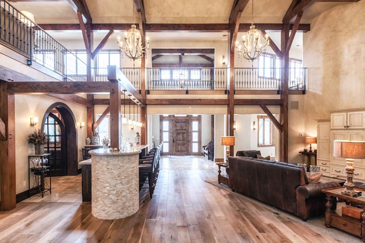 A large house with a lot of windows and wooden beams