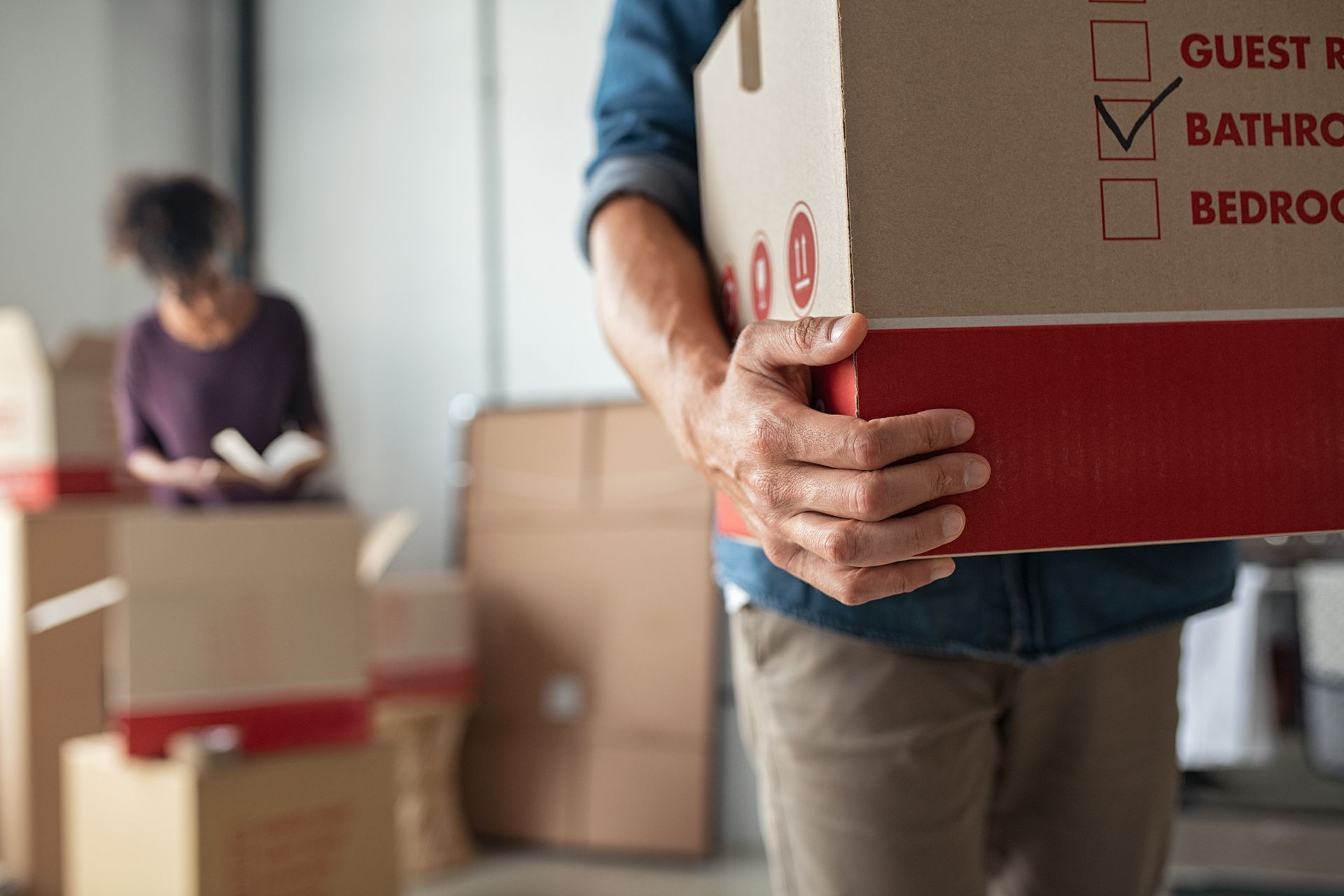 Man Carrying Box — Wailuku, HI — Tri Isle Inc.