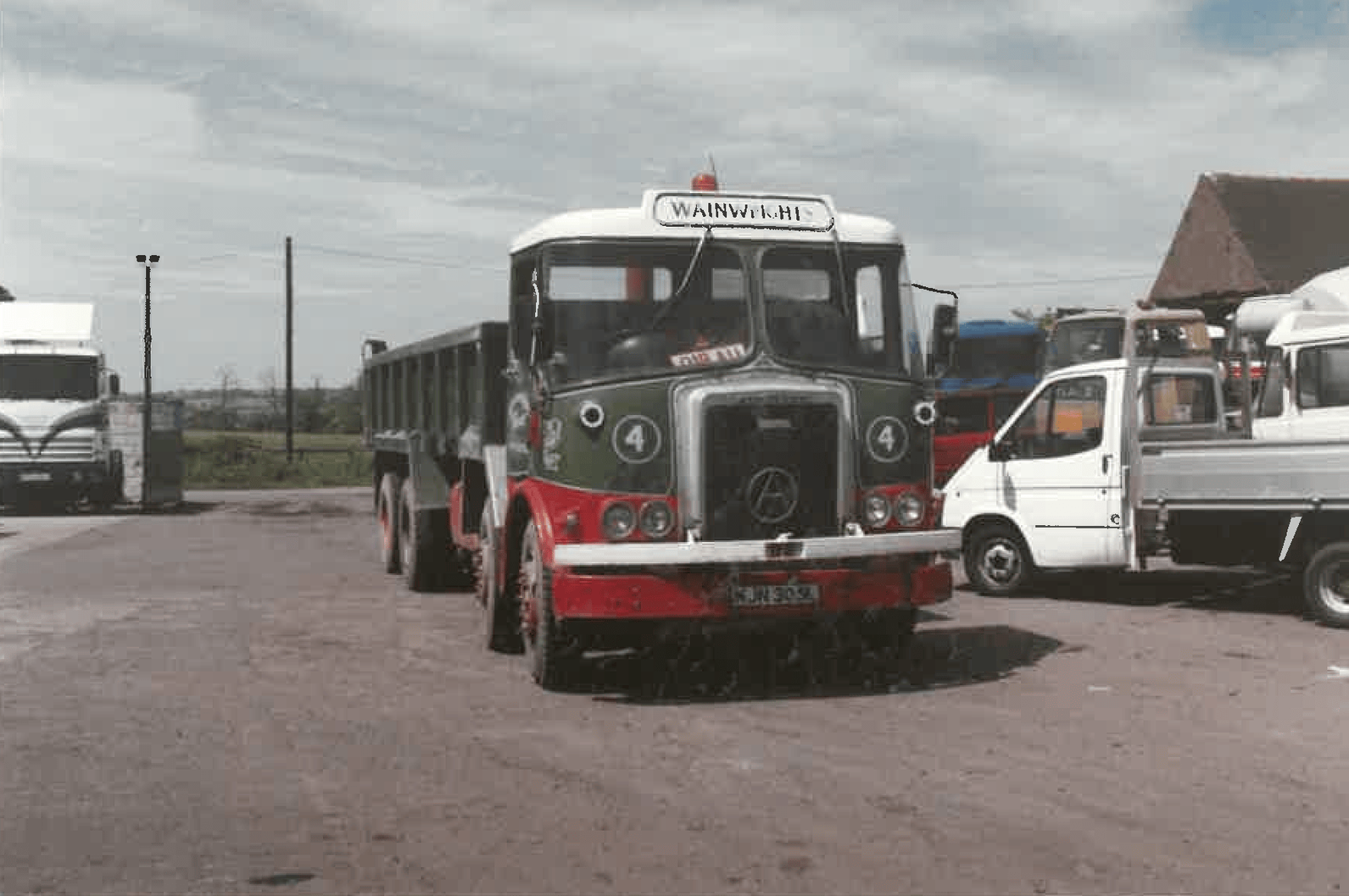 A vintage green and red wainwrights truck with