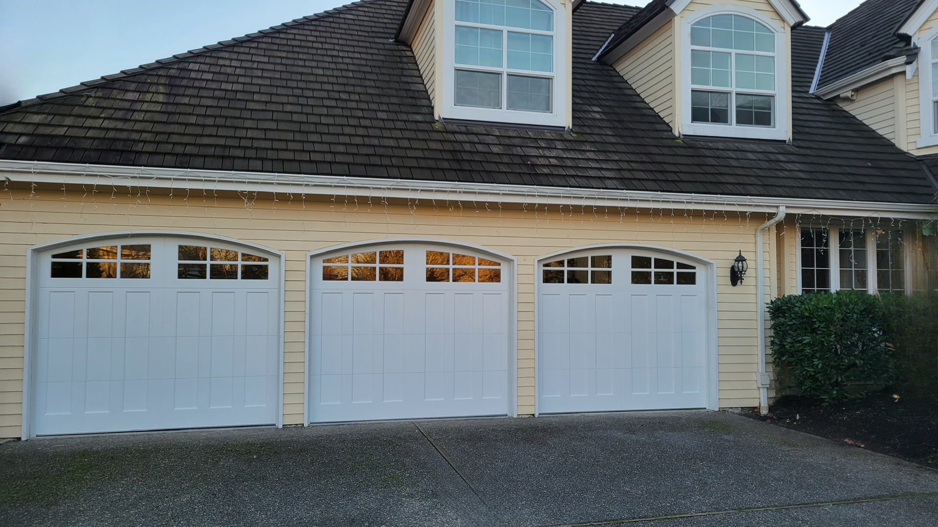 Carriage style steel garage door with traditional detailing installed by Garage Tech serving the Bothell, WA area