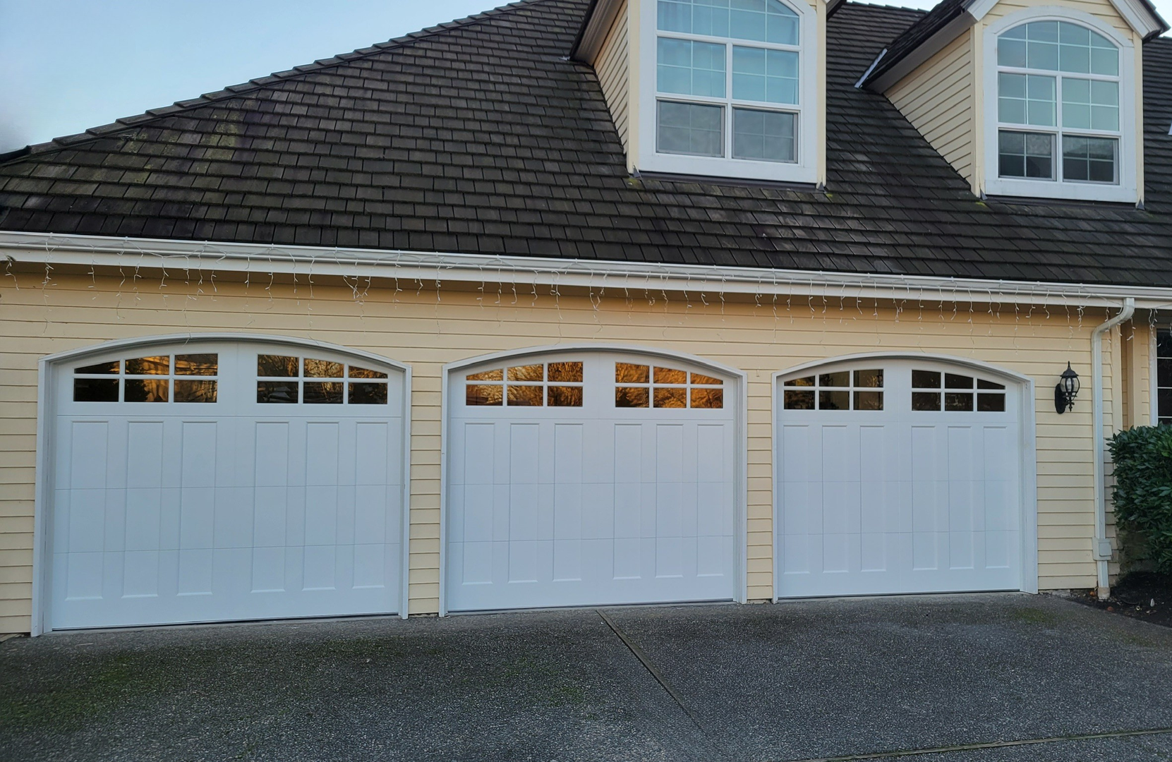 Steel carriage garage doors blending classic style and strength by Garage Tech serving Kirkland, WA
