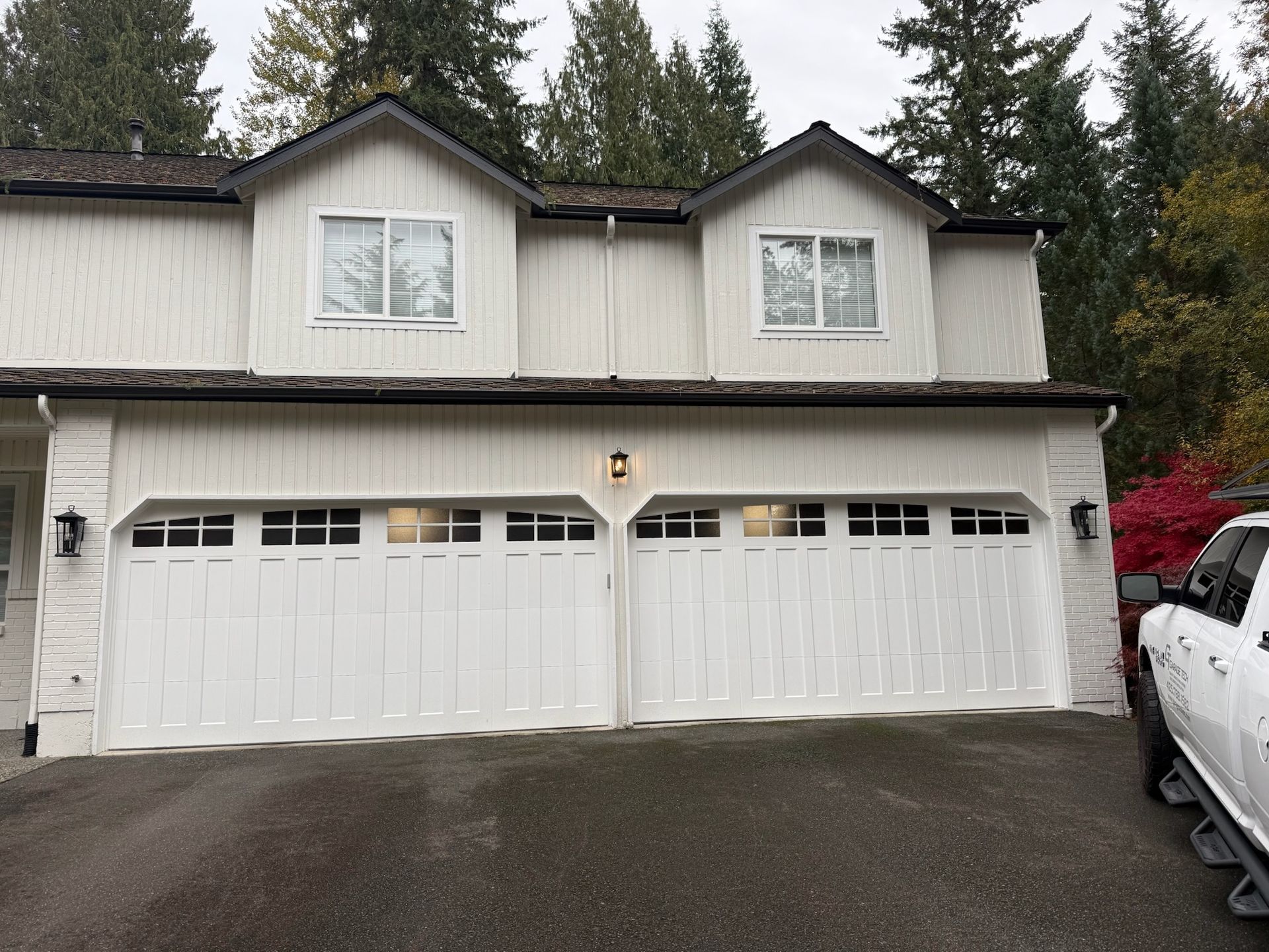 Contemporary garage door design with glass elements by Garage Tech serving Kirkland, WA