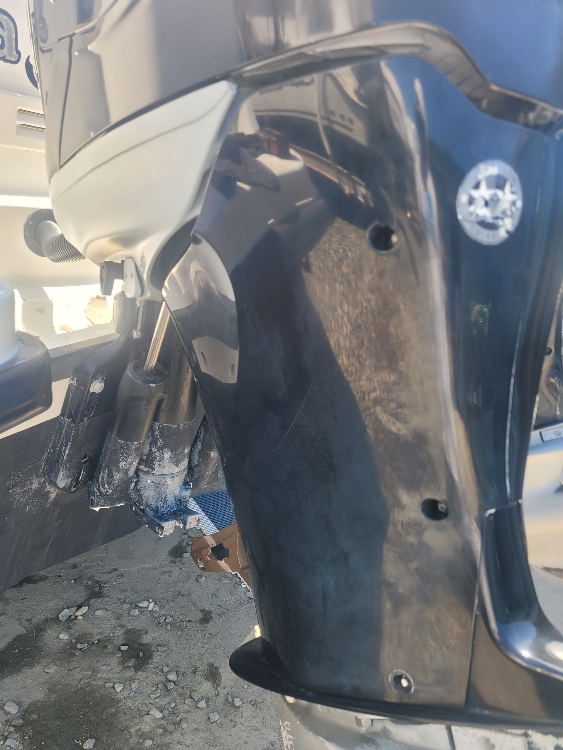 A close up of a car bumper with holes in it