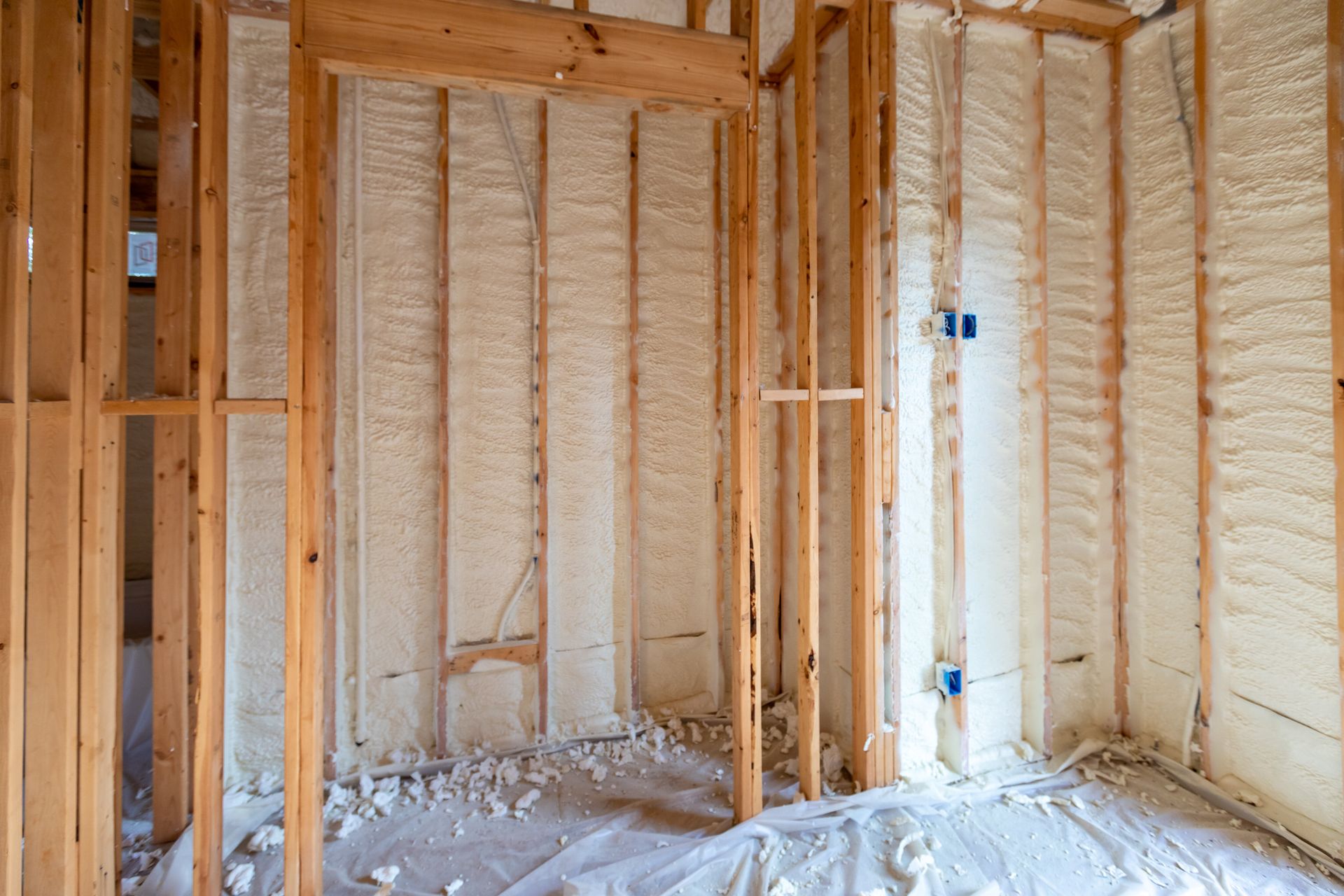 Walls with spray foam insulation in new house construction.