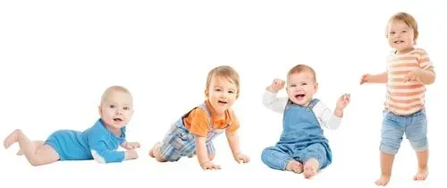 A group of babies are crawling , sitting , and standing in a row.