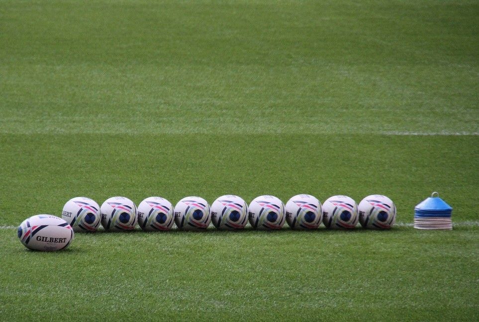 rugby balls on pitch