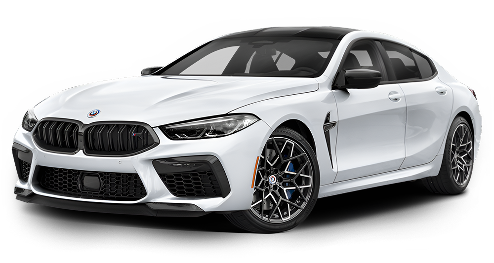 White BMW M8 Gran Coupe, sporty, four-door coupe, black trim, and wheels, parked.