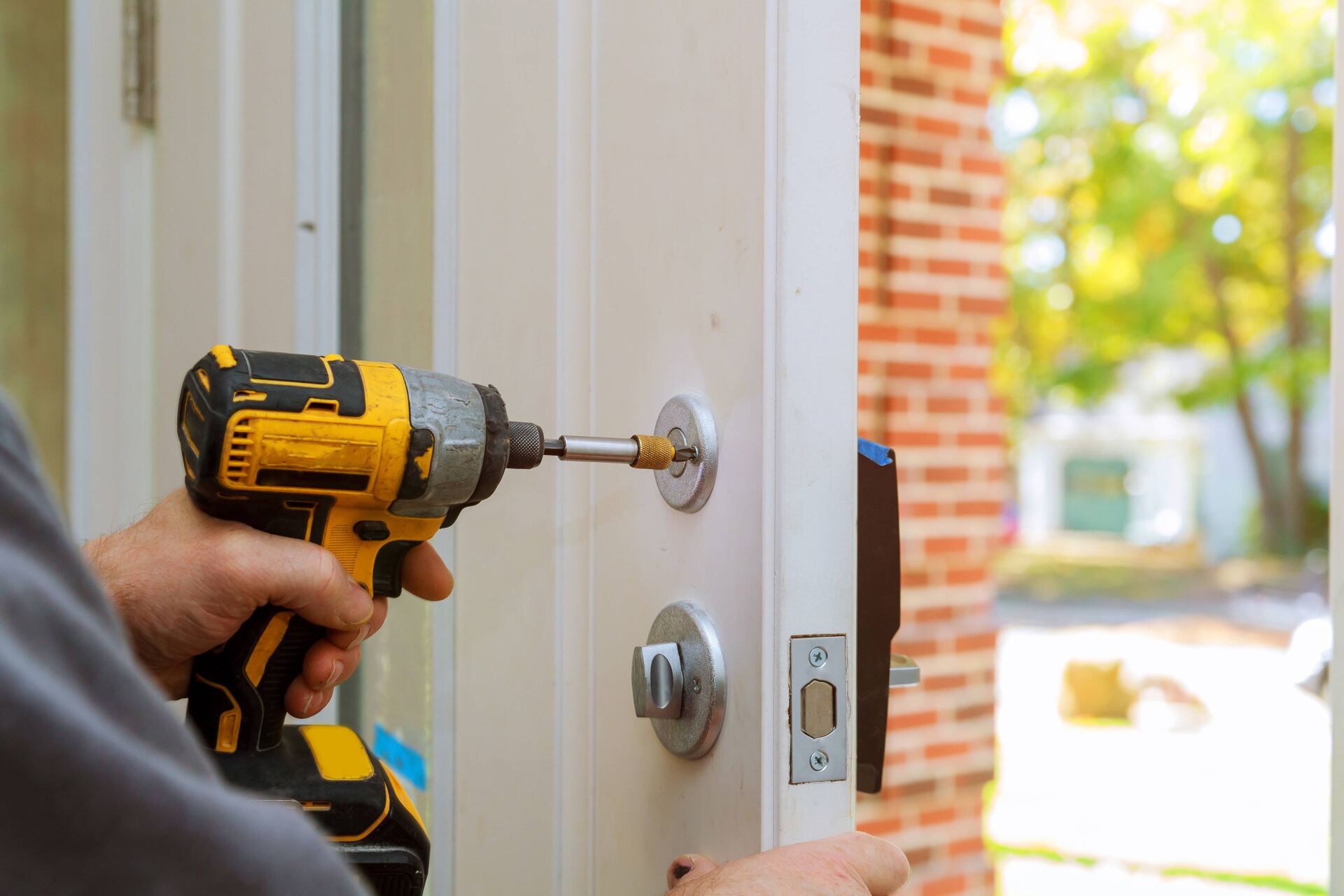 Man Repairing the Doorknob — Independence, VA — Primos Multi-Service