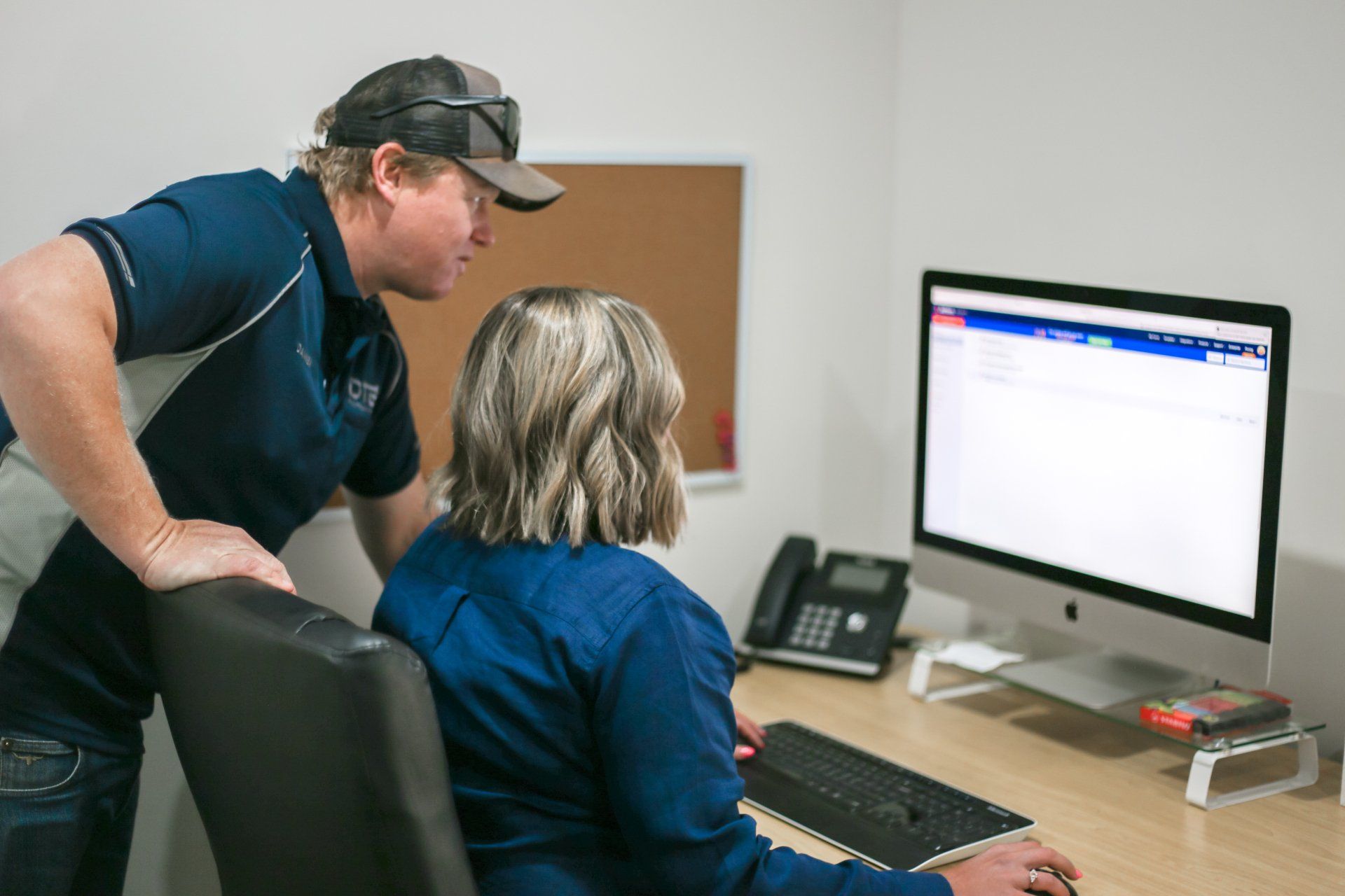 DTE Electrical Data Directors Looking at the Computer Screen