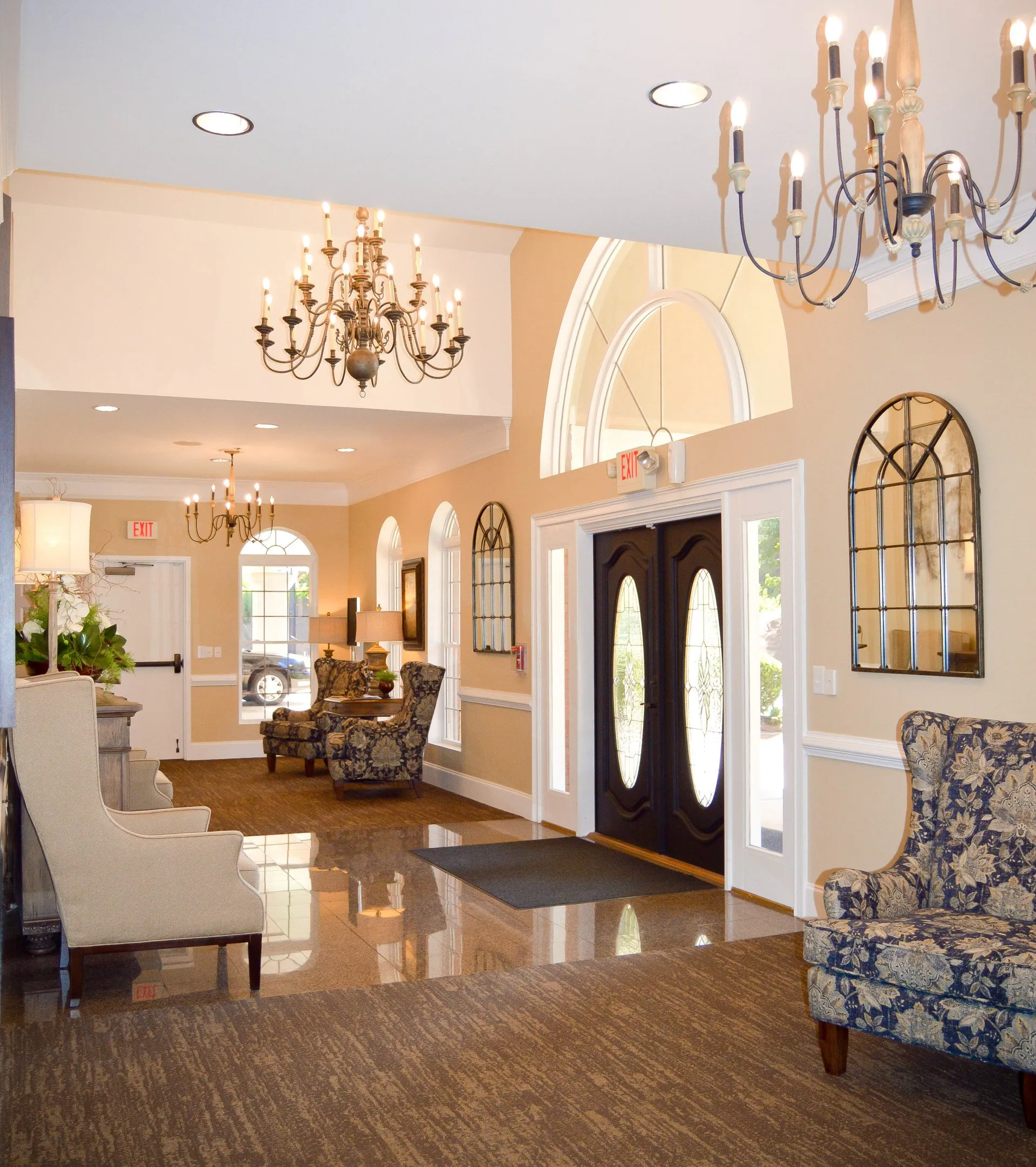 A large room with a lot of furniture and a chandelier