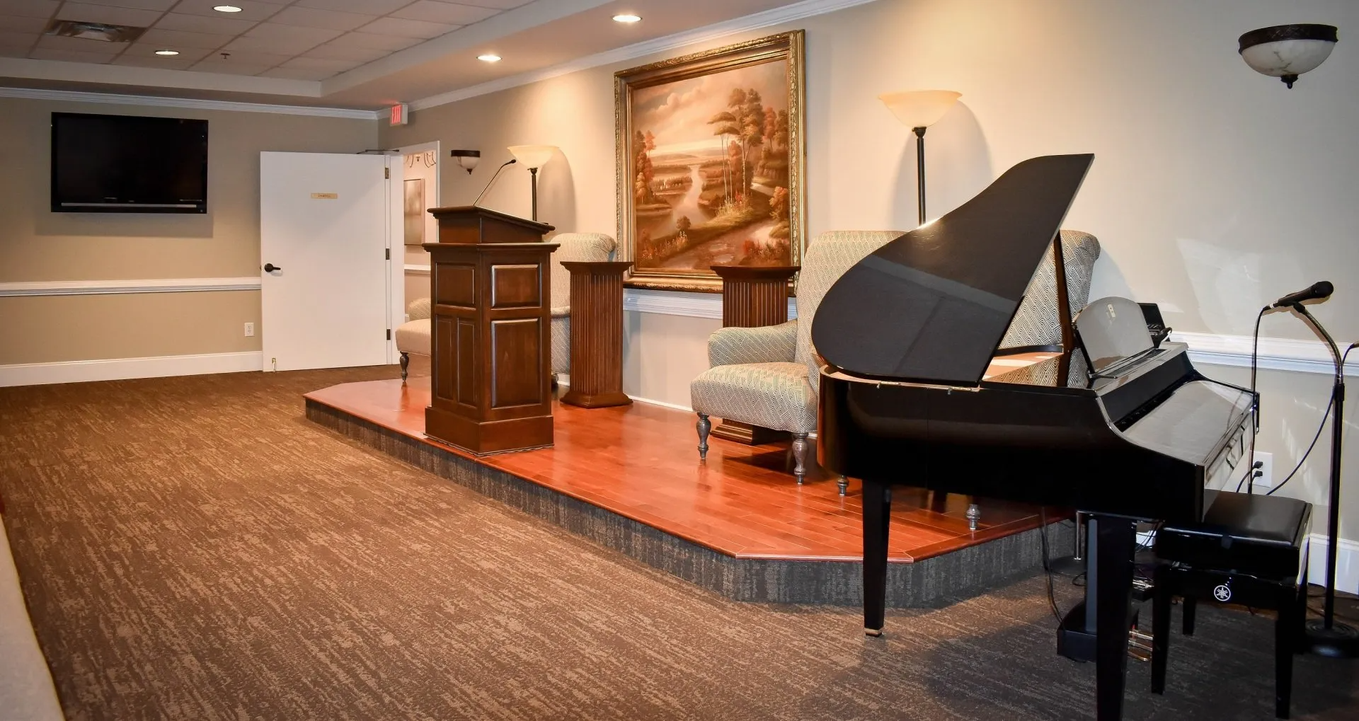 There is a piano in the middle of the room.