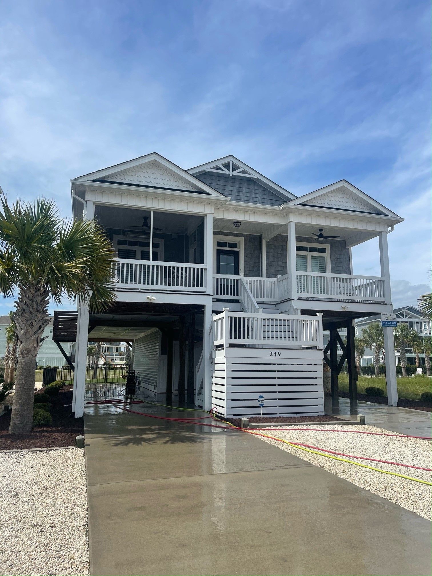 A Courtyard In Front Of A Building — Leland, NC — Coastal Exterior Solutions