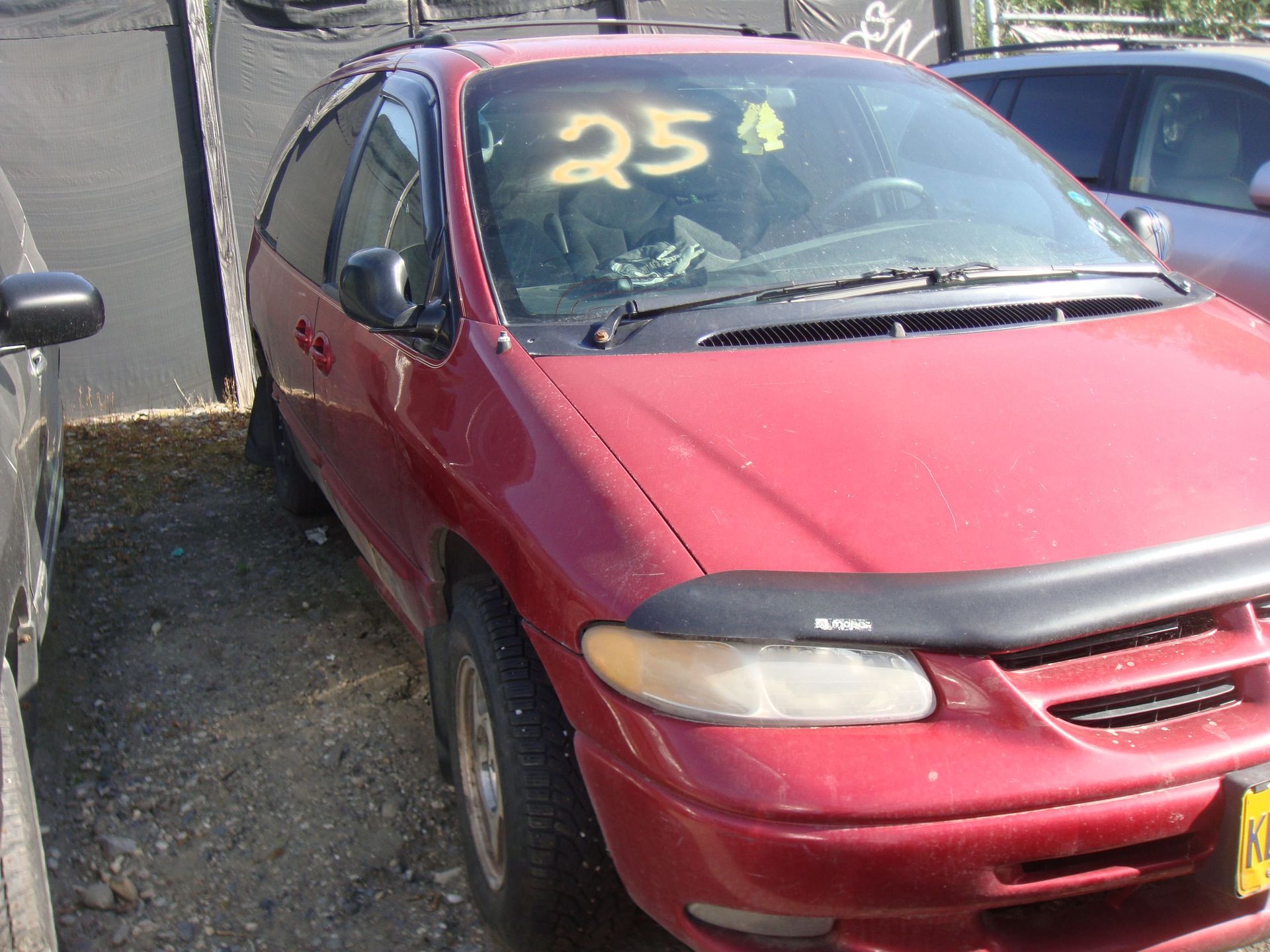 Red sedan with a yellow