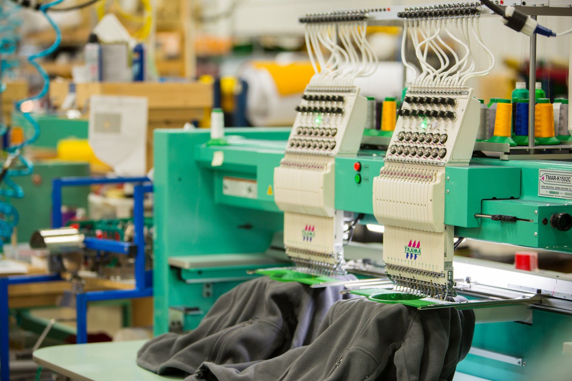 A machine for sewing custom names onto a jacket.