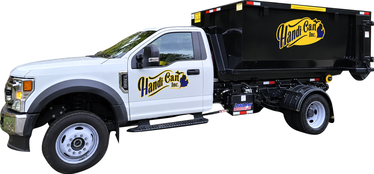 Handi Can Dumpster Rental roll-off truck delivering a dumpster in Midland, MI