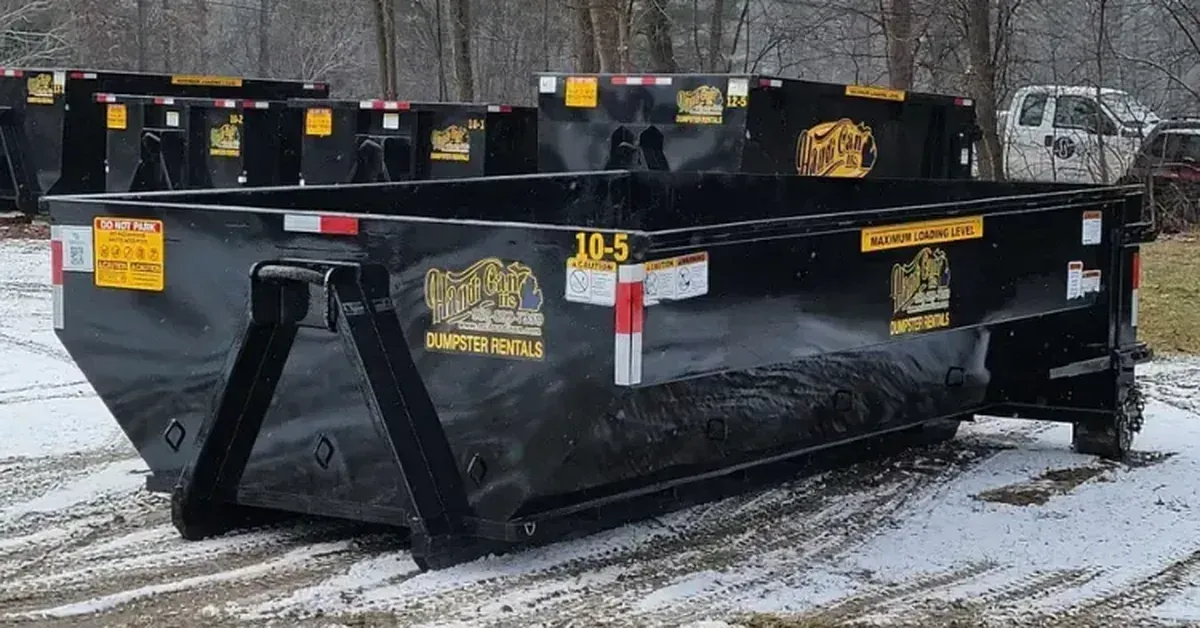 Handi Can roll-off dumpster parked on a snowy lot in Mid-Michigan